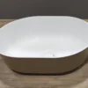 Bänkskivemonterat halvovalt tvättställ i Ocritech vit/beige 350x260 mm